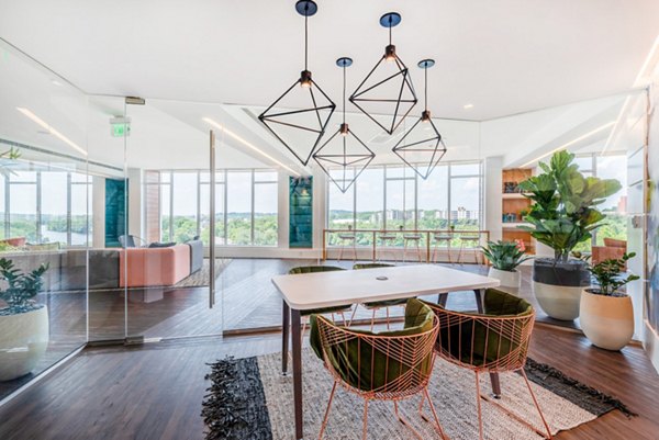 Clubhouse with modern seating and recreational areas at Radius Apartments in luxury Greystar community