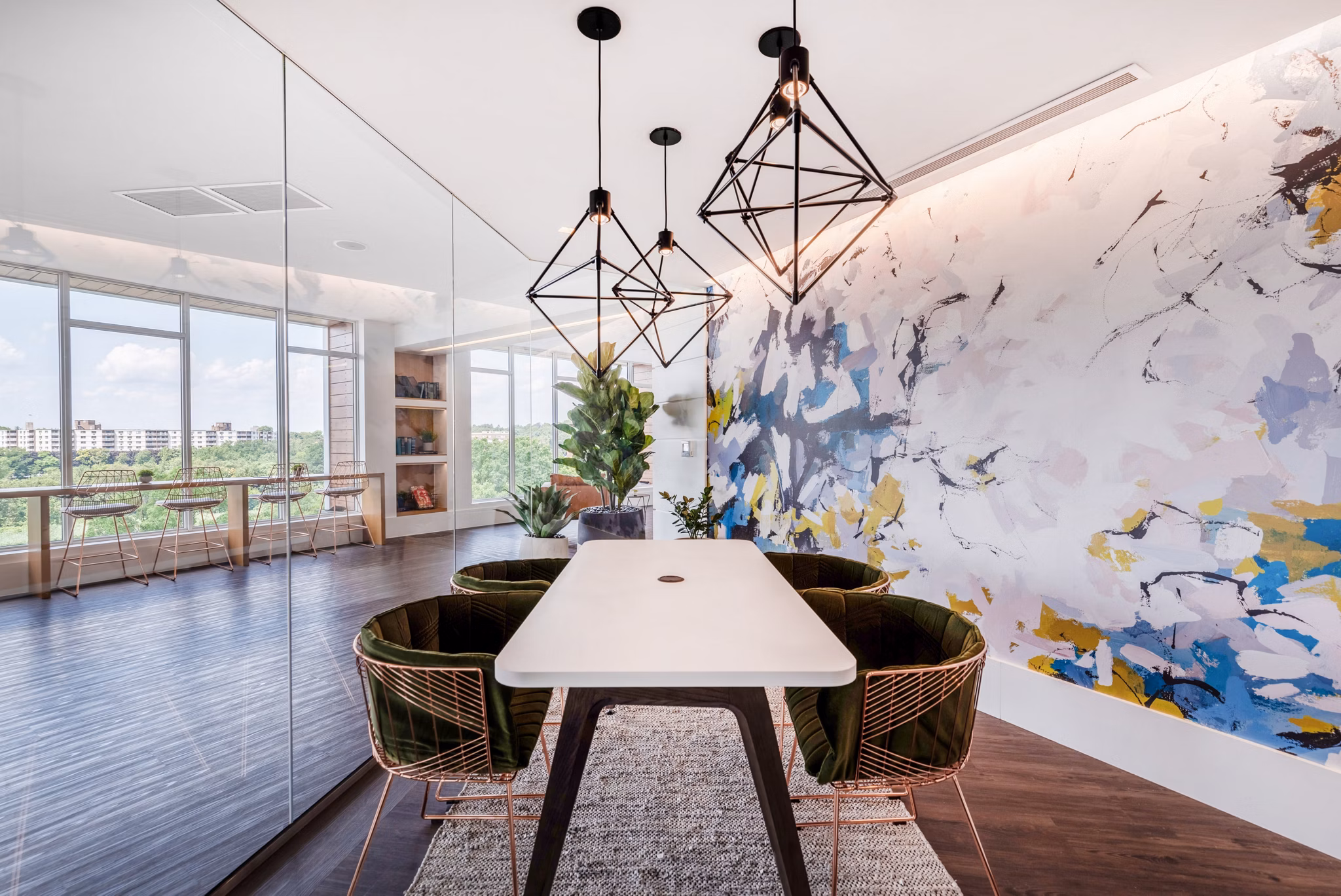 Modern clubhouse with lounge seating and pool table at Radius Apartments