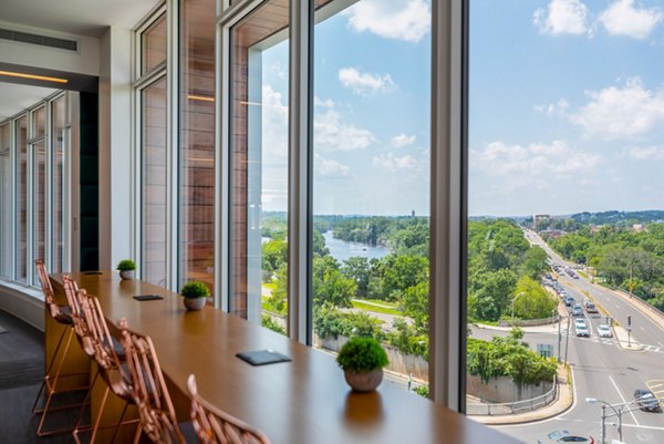 Clubhouse with modern decor and ample seating at Radius Apartments