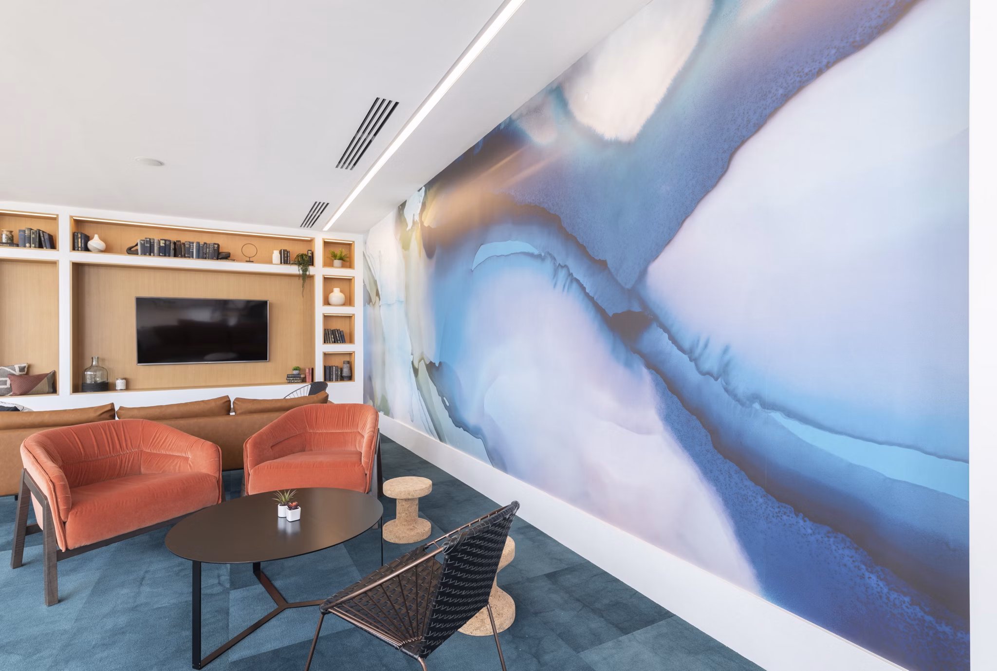 Radius Apartments: Modern clubhouse featuring sleek interiors and ample seating for social gatherings