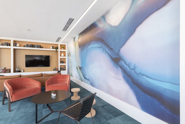 Radius Apartments: Modern clubhouse featuring sleek interiors and ample seating for social gatherings