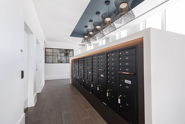 Modern mail room with secure package lockers at Radius Apartments