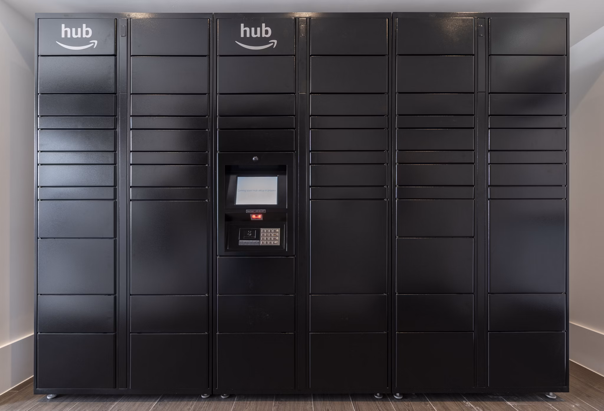 Modern mail room with secure package lockers at Radius Apartments