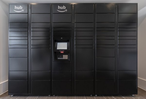 Modern mail room with secure package lockers at Radius Apartments