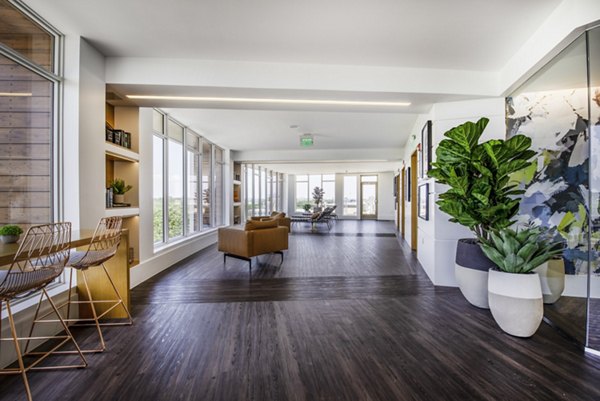 Modern clubhouse with stylish seating and vibrant decor at Radius Apartments