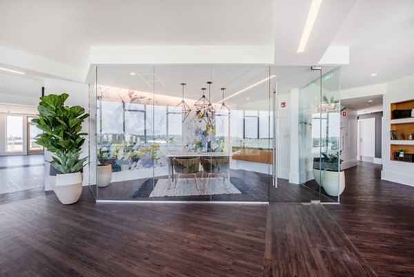 Clubhouse featuring modern design and ample seating at Radius Apartments