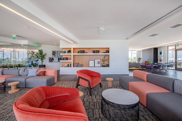 Spacious clubhouse featuring modern furnishings at Radius Apartments; ideal for luxury community gatherings and entertainment