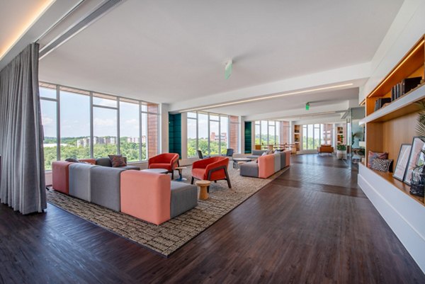 Luxurious clubhouse with contemporary design at Radius Apartments, featuring spacious seating areas and modern decor
