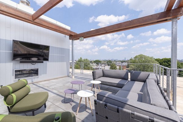 Courtyard featuring lush greenery and seating areas at Radius Apartments