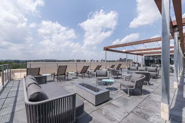 Cozy outdoor fire pit area at Radius Apartments, perfect for social gatherings and relaxation
