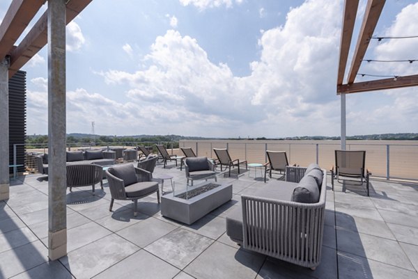 Outdoor fire pit lounge area at Radius Apartments providing a cozy social space