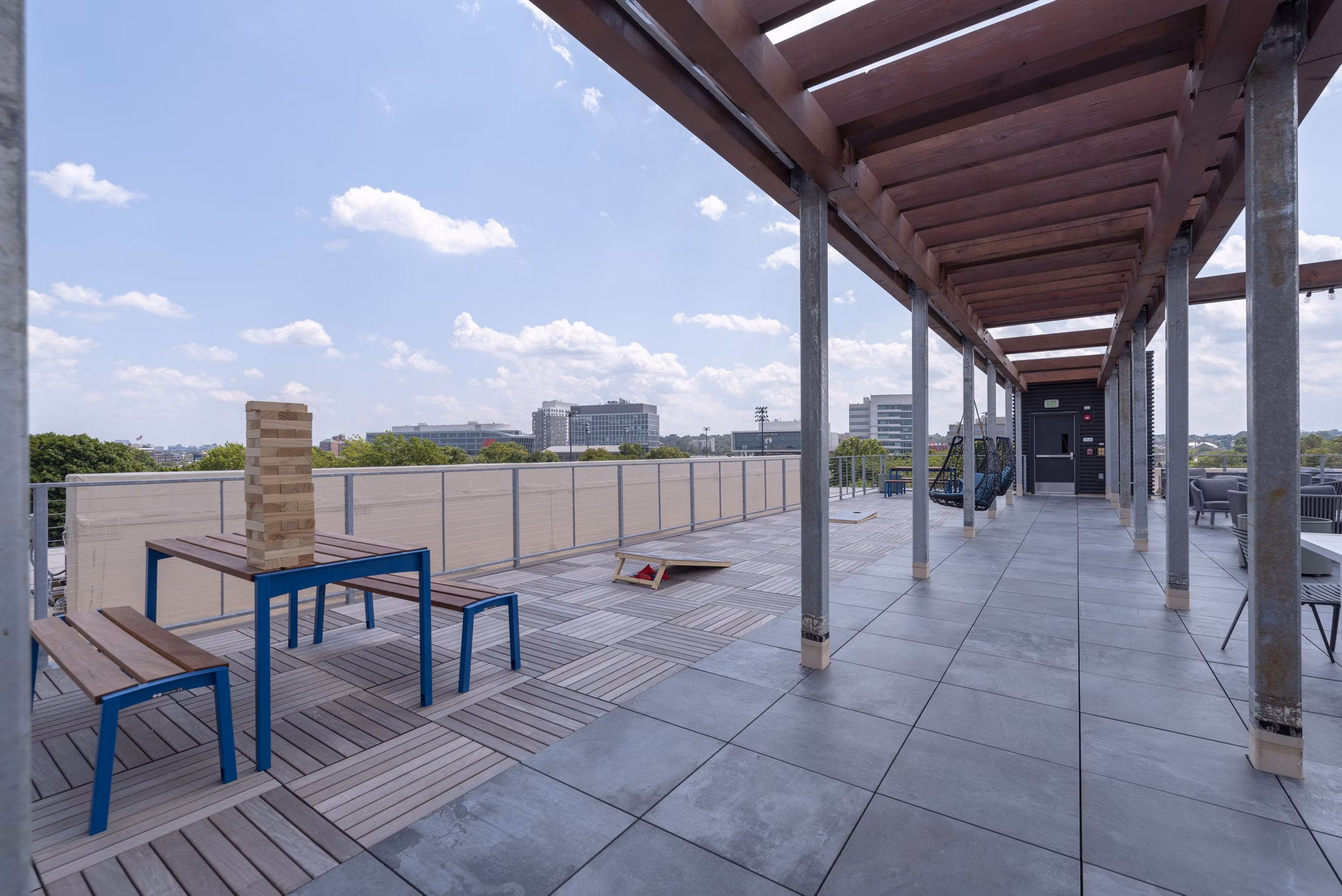 Courtyard with lush landscaping at Radius Apartments, featuring outdoor seating and walking paths