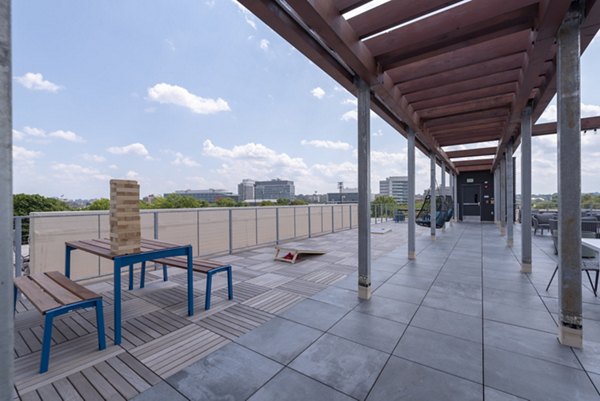 Courtyard with lush landscaping at Radius Apartments, featuring outdoor seating and walking paths