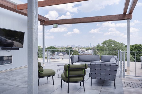 Courtyard with cozy seating and lush landscaping at Radius Apartments, offering luxurious outdoor living spaces in a vibrant community