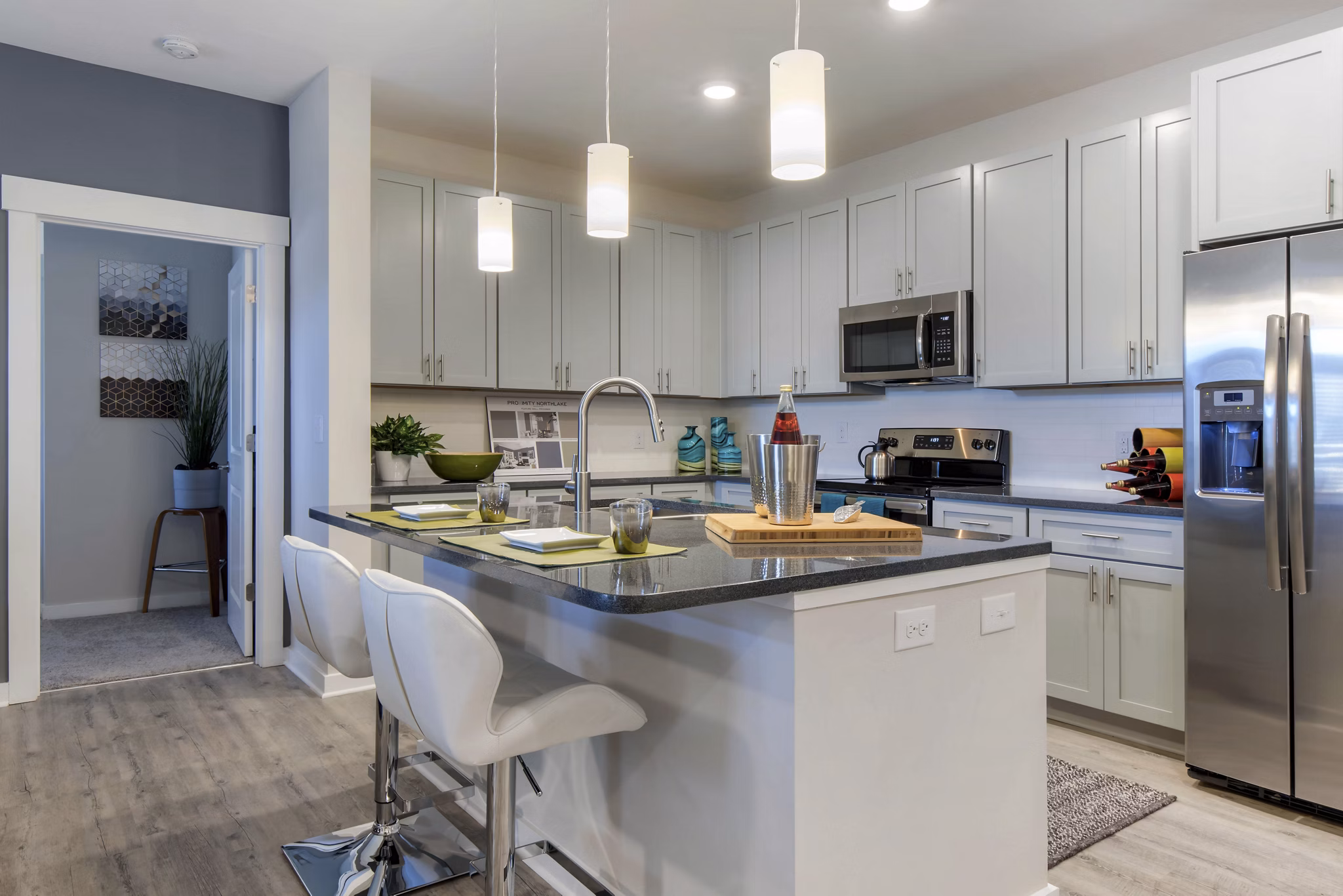Modern kitchen with stainless steel appliances in Proximity Northlake Apartments