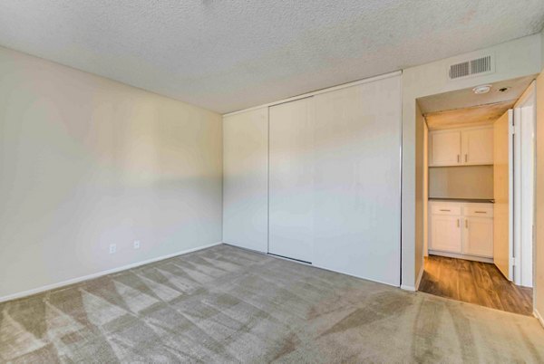 Cozy bedroom with stylish decor in Solana at Grand Apartments