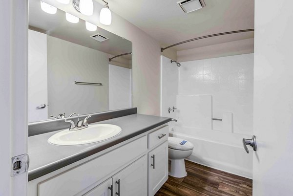 Solana at Grand: Modern bathroom with sleek fixtures and ample lighting in luxury apartment