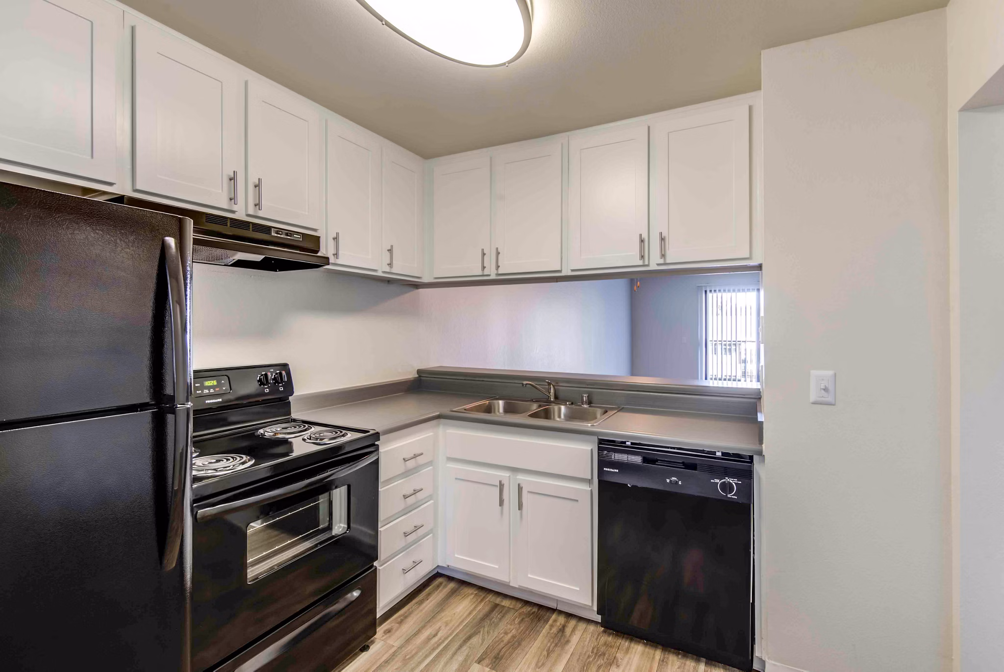 Modern kitchen with stainless steel appliances at Solana at Grand Apartments