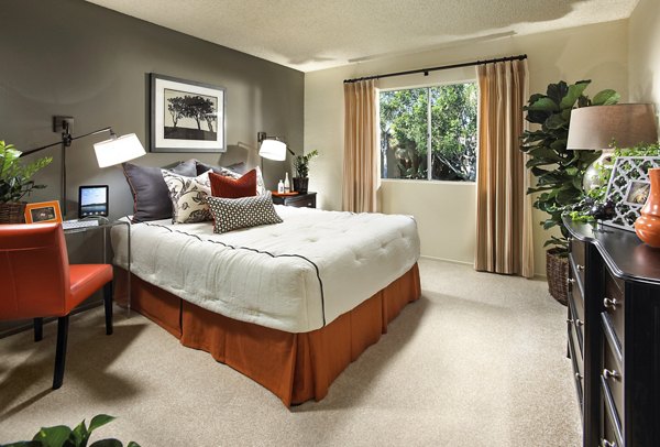 â€œCozy bedroom featuring a bed, nightstands, and plants in luxury apartmentâ€