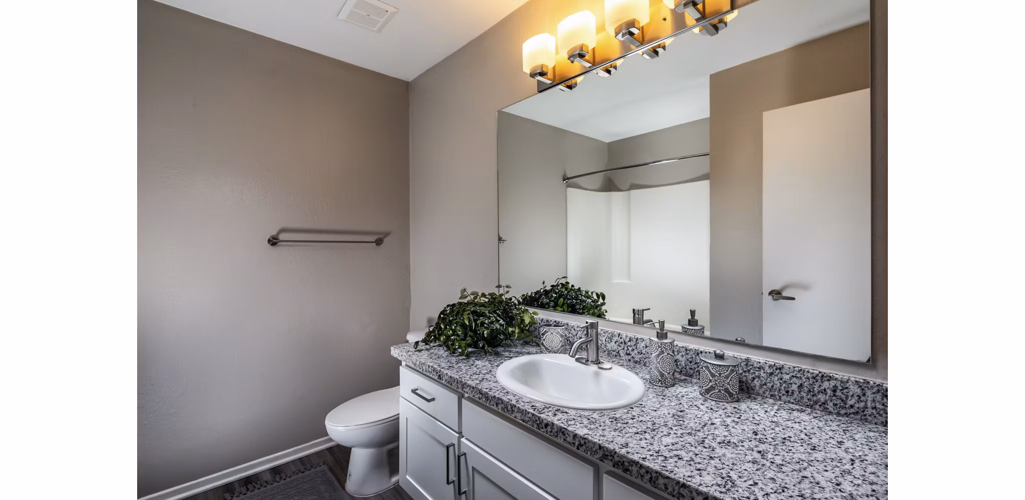 Elegant bathroom with marble countertops and modern fixtures at Corte Bella Apartments