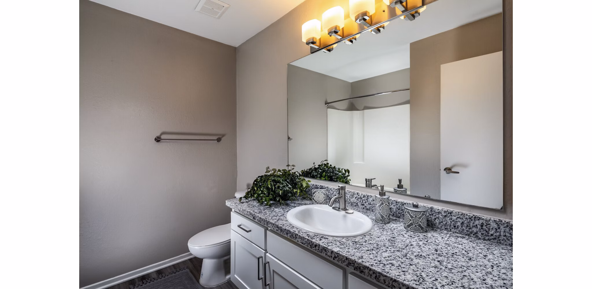 Elegant bathroom with marble countertops and modern fixtures at Corte Bella Apartments