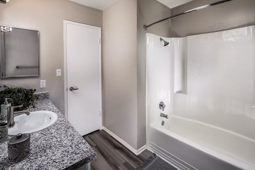Bathroom featuring sleek fixtures and modern design at Corte Bella Apartments, offering luxury living with contemporary amenities