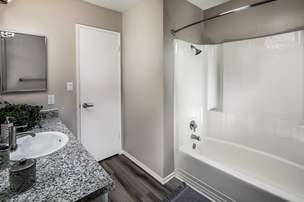 Bathroom featuring sleek fixtures and modern design at Corte Bella Apartments, offering luxury living with contemporary amenities