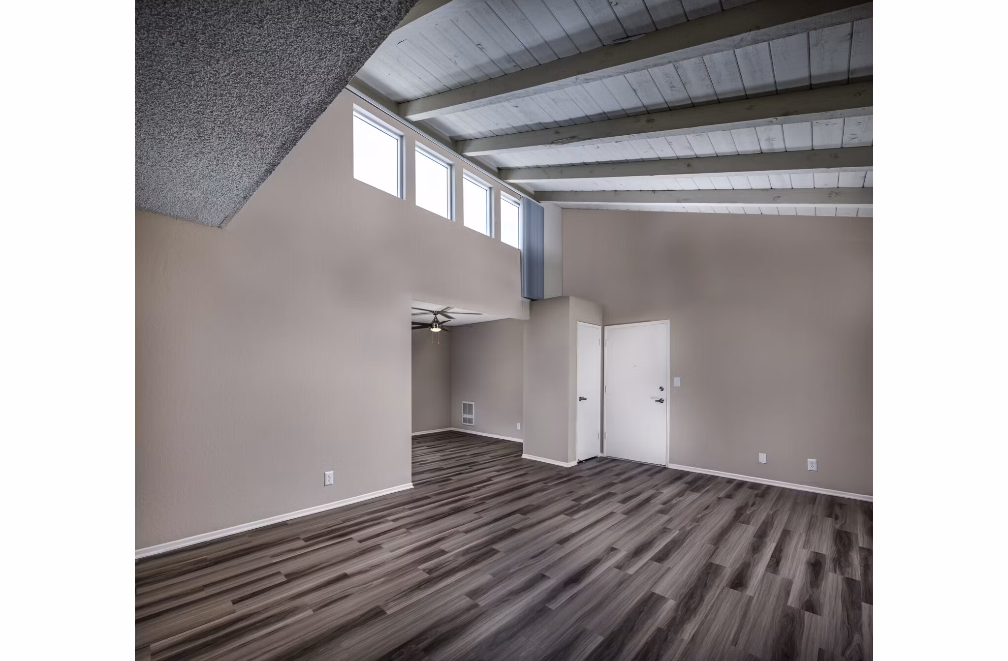Spacious living room with chic decor in Corte Bella Apartments