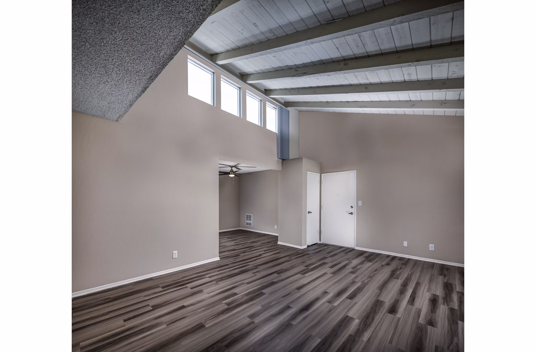 Spacious living room with chic decor in Corte Bella Apartments