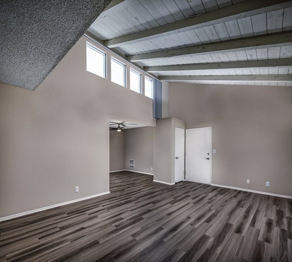 Spacious living room with chic decor in Corte Bella Apartments