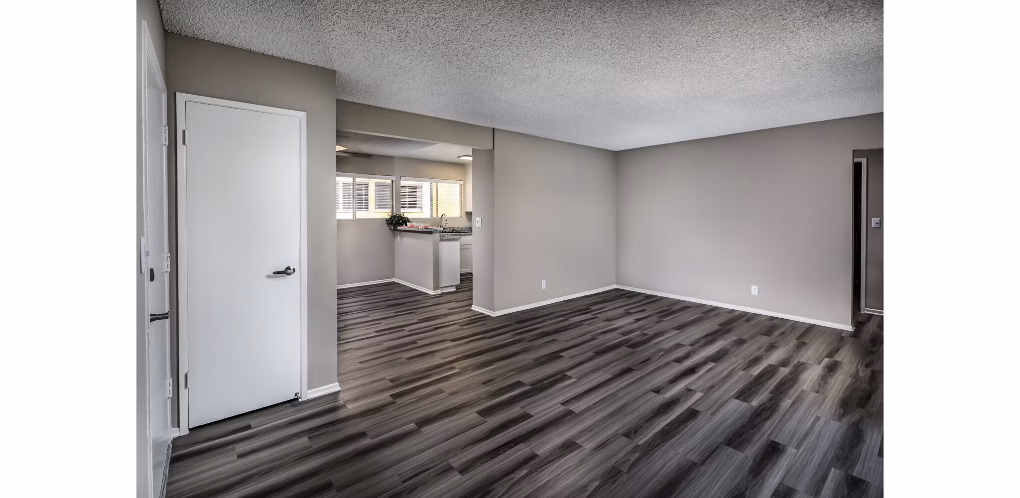 Elegant living room featuring modern decor and natural light at Corte Bella Apartments