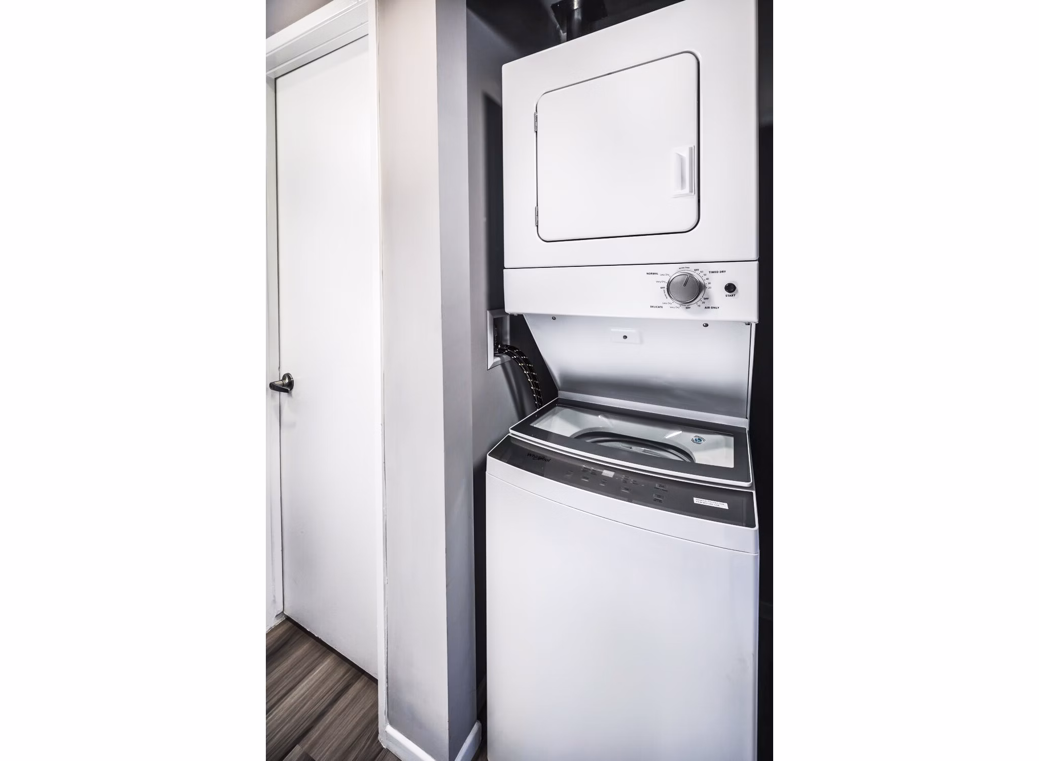 Laundry room with modern appliances at Corte Bella Apartments