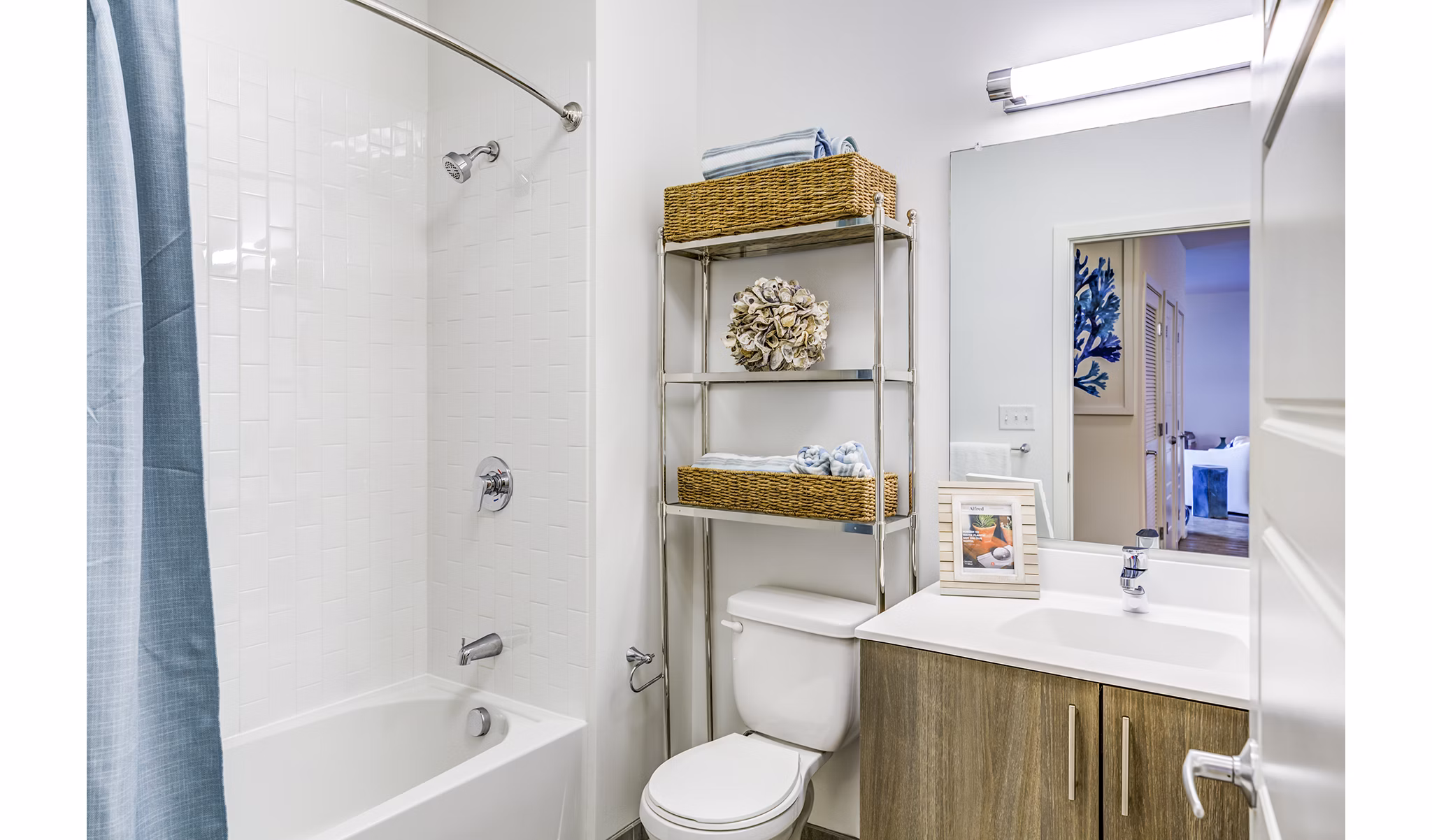 Modern bathroom featuring marble countertops and sleek fixtures at Ocean 650 Apartments