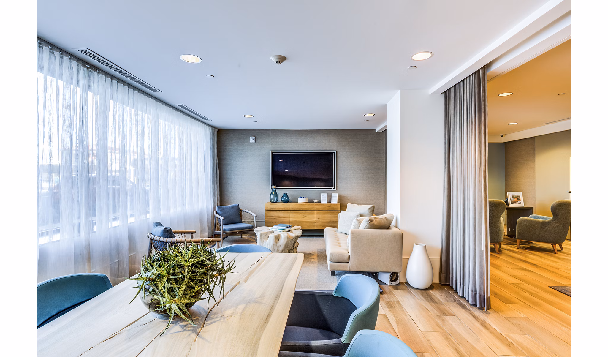 Modern clubhouse and lobby with elegant seating and decor at Ocean 650 Apartments, luxury living in a coastal setting