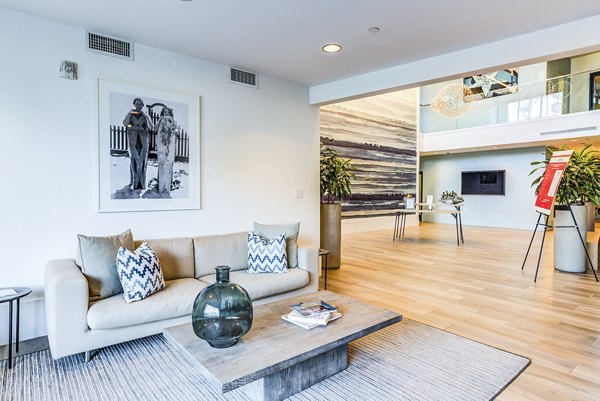 Clubhouse lobby with modern decor and comfortable seating at Ocean 650 Apartments, a luxury community offering stylish amenities and spaces