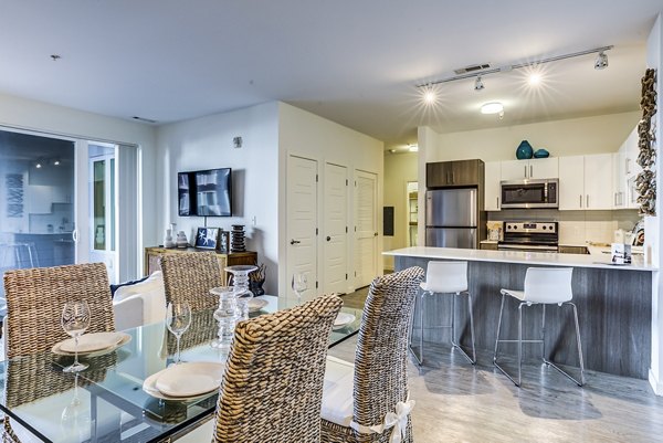 Dining room with modern decor and ocean views at Ocean 650 Apartments