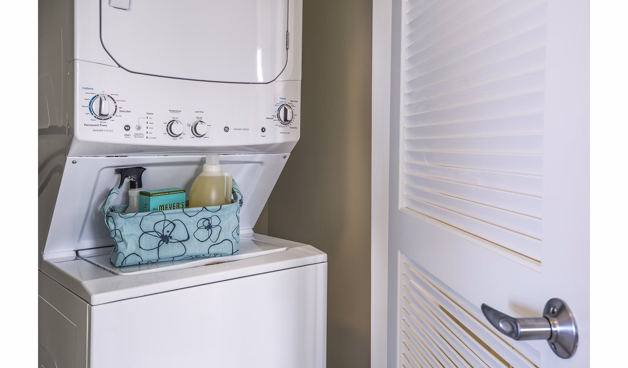 Laundry room featuring high-efficiency washers and dryers in Ocean 650 Apartments