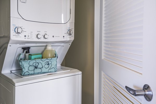 Laundry room featuring high-efficiency washers and dryers in Ocean 650 Apartments