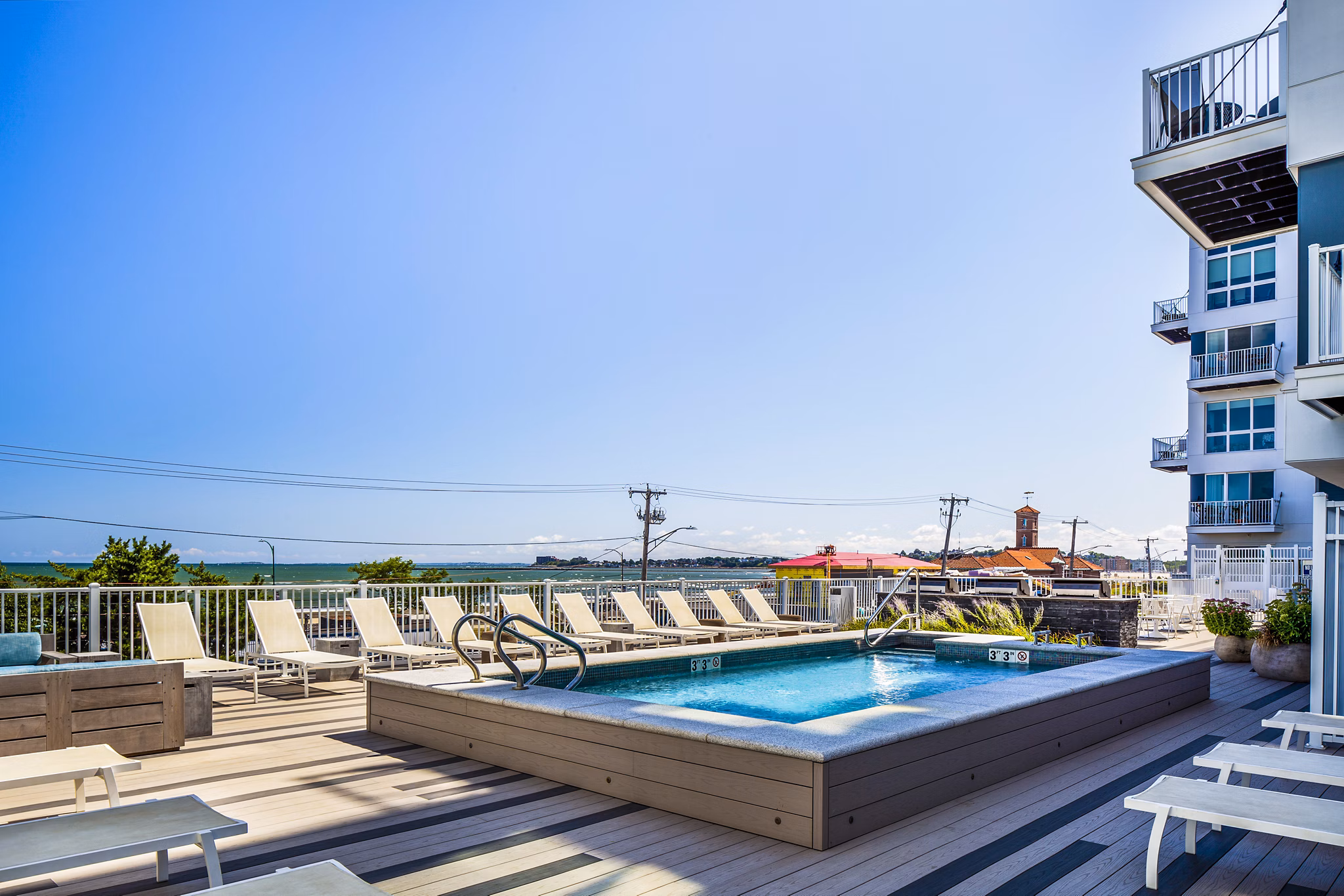 Infinity-edge pool at Ocean 650 Apartments offering stunning sea views