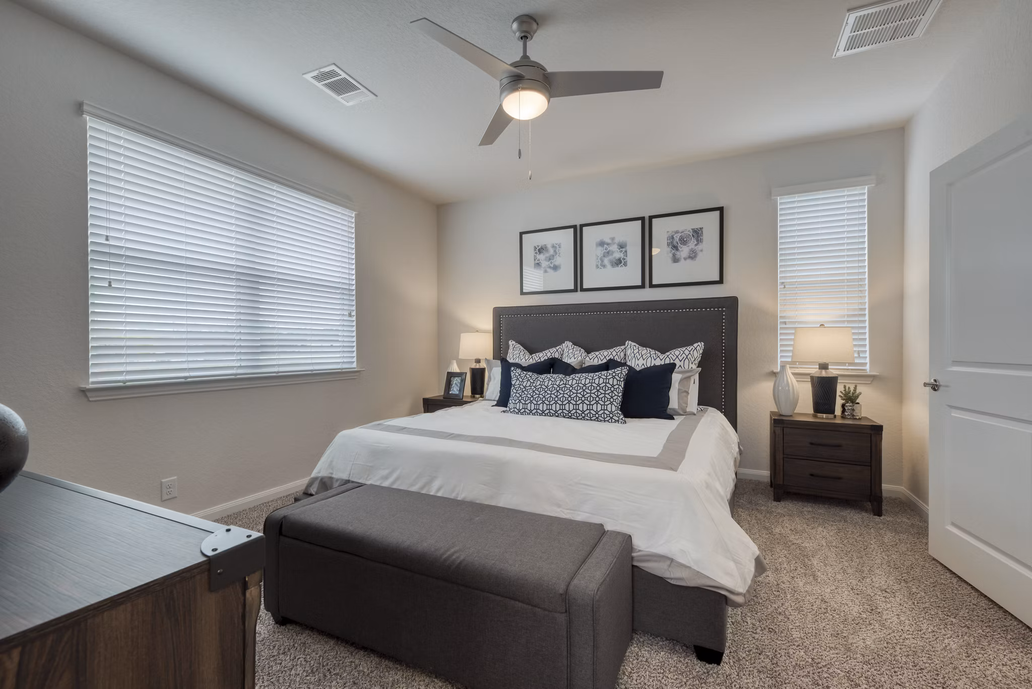 Elegant bedroom featuring a king-size bed and modern decor at Pradera Luxury Rental Homes