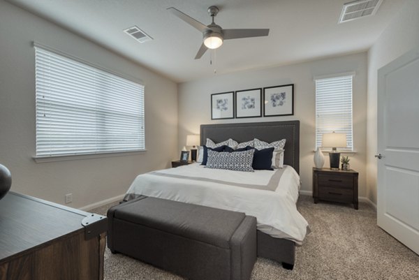 Elegant bedroom featuring a king-size bed and modern decor at Pradera Luxury Rental Homes