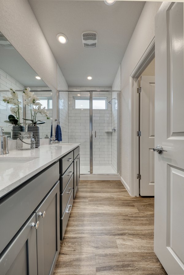 Luxury bathroom featuring double sinks and modern fixtures at Pradera Luxury Rental Homes