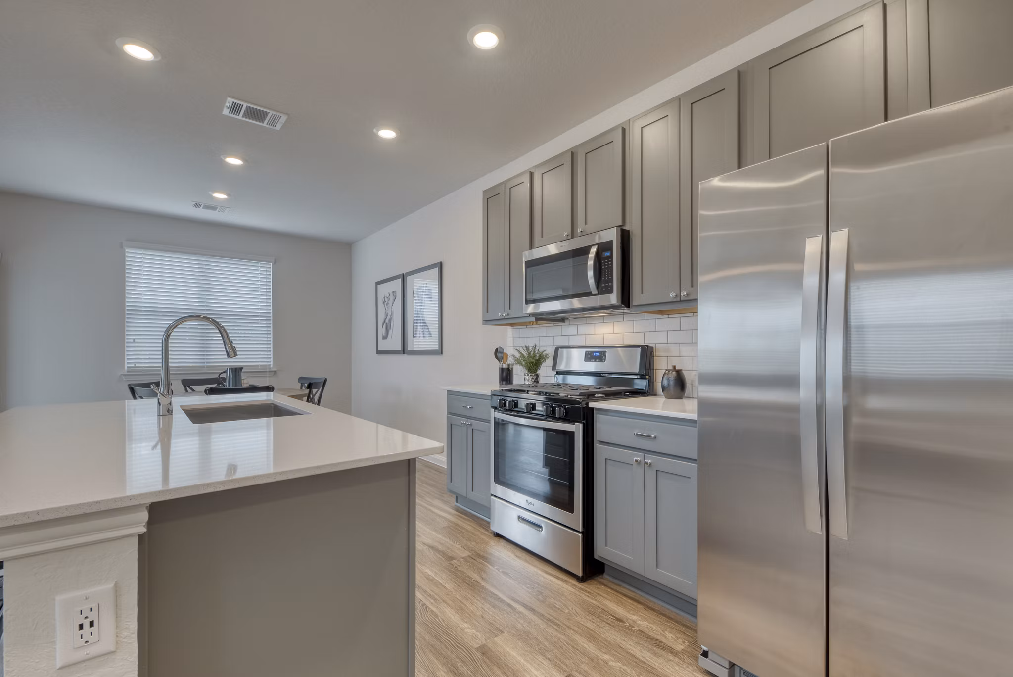 Modern kitchen with stainless steel appliances at Pradera Luxury Rental Homes, ideal for cooking and entertaining