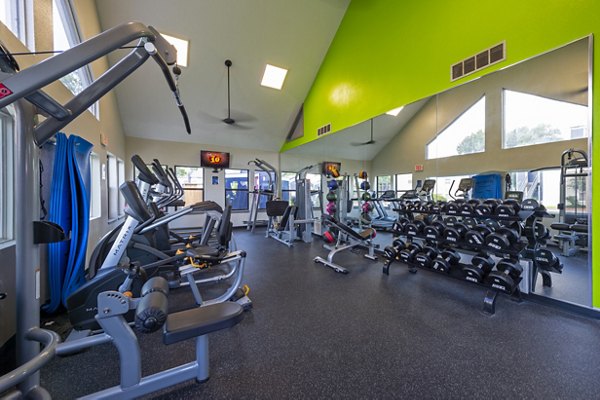 Modern fitness center with state-of-the-art equipment at Raintree Apartments