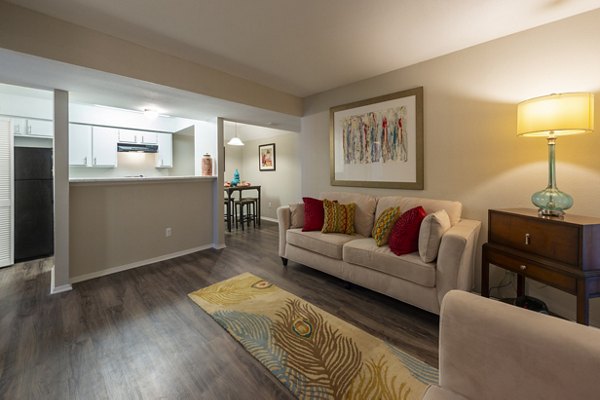 Cozy living room with contemporary furnishings in Raintree Apartments