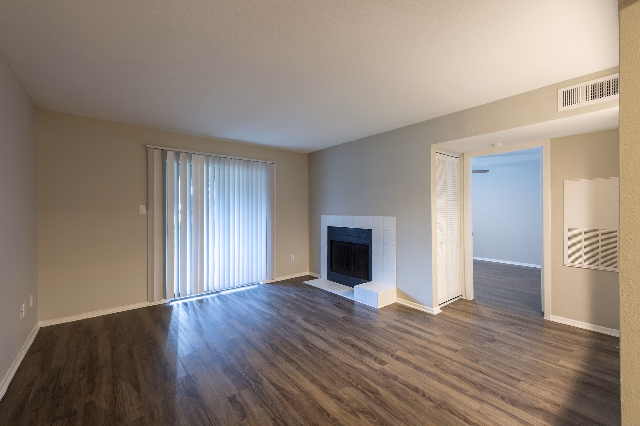 Living room featuring contemporary design and cozy seating in Raintree Apartments