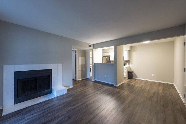 Spacious living room with modern decor in Raintree Apartments