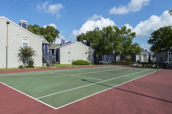 Tennis court at Raintree Apartments: Well-maintained outdoor sport facility for residents at luxury apartments