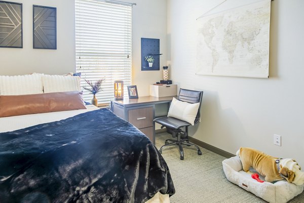 Cozy bedroom with modern decor at College View Apartments