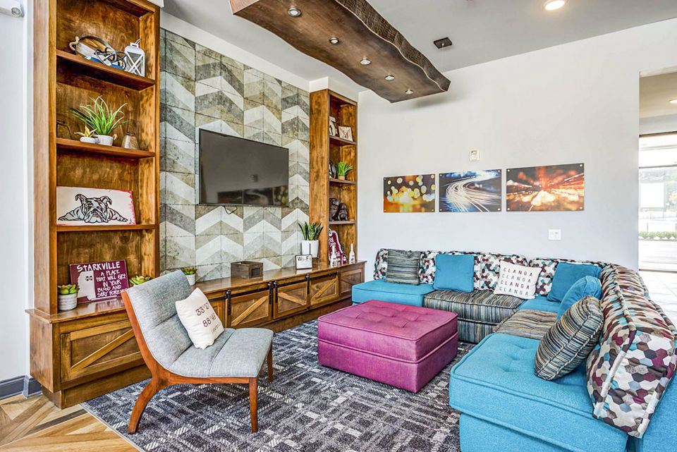 Clubhouse featuring modern design and comfortable seating at College View Apartments
